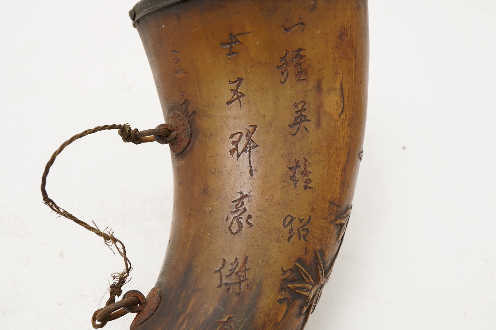 A Tibetan or Mongolian inscribed buffalo horn powder flask, 18th century